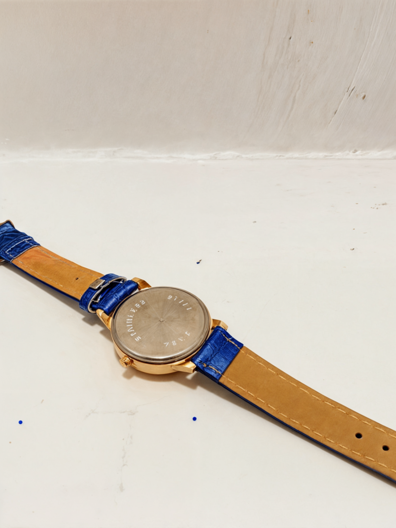 blue watch face down